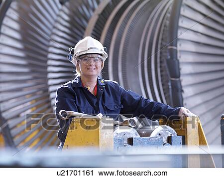 Female Engineer With Turbine View Large Photo Image Stock Image - Female Engineer With Turbine. Fotosearch