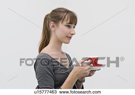 Female holding a red cup. View Large Photo Image Stock Image - Female holding a red cup.. Fotosearch