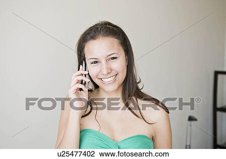 Stock Image - Female on a mobile phone. Fotosearch