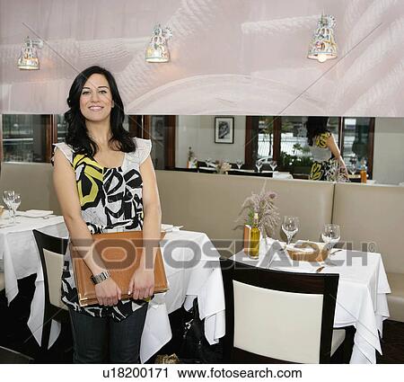 Stock Image - Female restaurant owner. Fotosearch