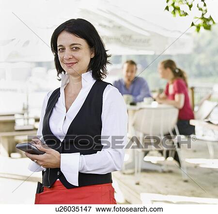 Stock Photo - Female waitress taking orders. Fotosearch