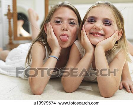 Friends showing make-up experiments View Large Photo Image Picture - Friends showing make-up experiments. Fotosearch