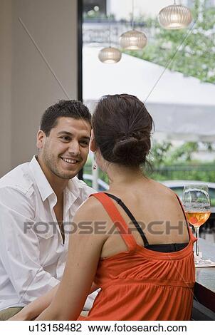 Friends sitting at bar drinking View Large Photo Image Stock Image - Friends sitting at bar drinking. Fotosearch