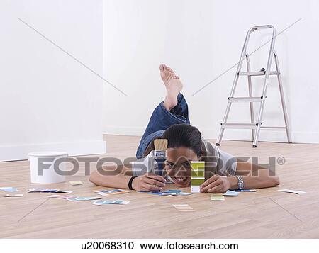 Girl choosing paint colours View Large Photo Image Stock Image - Girl choosing paint colours. Fotosearch
