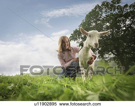 Girl Holding Goat View Large Photo Image Stock Photography - Girl Holding Goat. Fotosearch