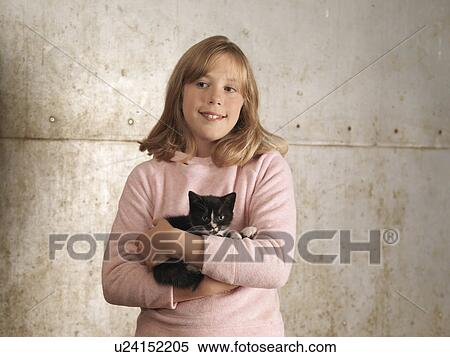 Stock Photography - Girl Holding Kitten. Fotosearch