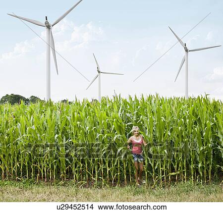 Girl in a corn field View Large Photo Image Picture - Girl in a corn field. Fotosearch