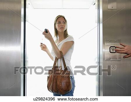 Stock Photograph - Girl in lift. Fotosearch