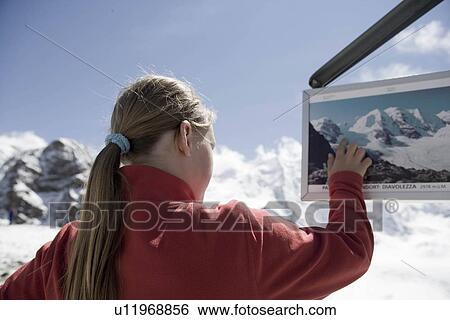 girl looking around in mountainous area View Large Photo Image Stock Photograph - girl looking around in mountainous area. Fotosearch