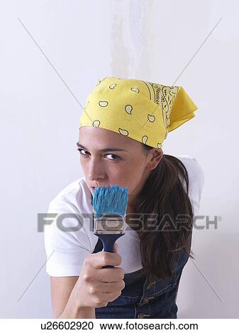 Stock Image - Girl painting.. Fotosearch