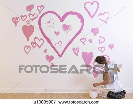 Girl paints pink hearts. View Large Photo Image Stock Photo - Girl paints pink hearts.. Fotosearch