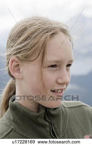 Stock Photo - girl sunbathing her face eyes closed. Fotosearch