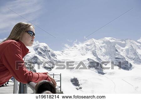 Picture - girl viewing mountain scenery. Fotosearch