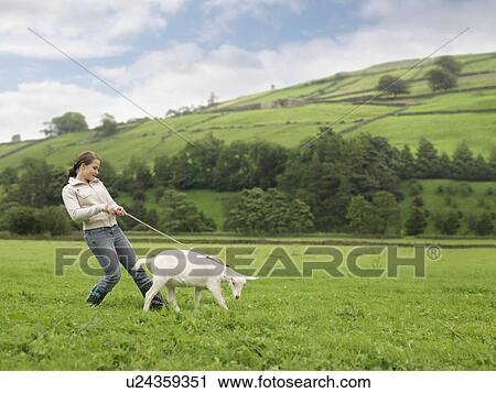 Stock Image - Girl With Goat On Rope. Fotosearch
