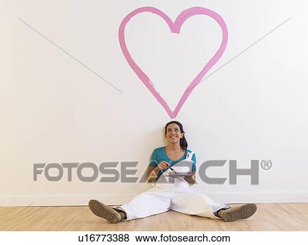 Stock Photo - Girl with heart painting.. Fotosearch