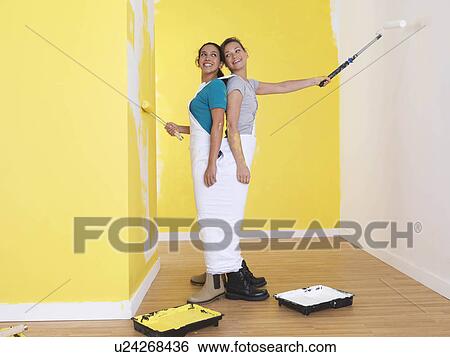 Girls painting in the same trousers. View Large Photo Image Stock Photograph - Girls painting in the same trousers.. Fotosearch