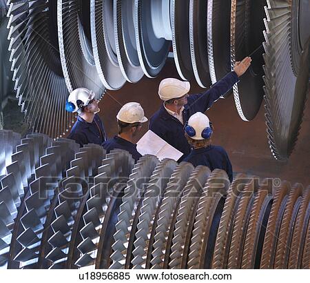 Stock Photography - Group Of Engineers With Turbines. Fotosearch