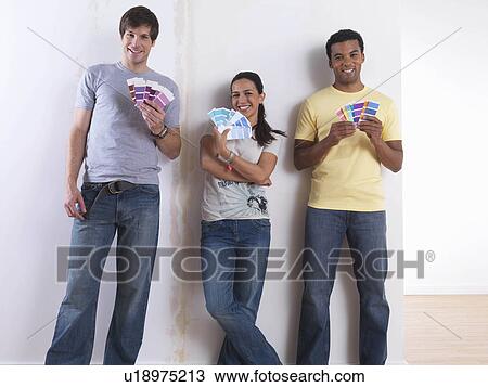 Group of friends choosing paint colours View Large Photo Image Stock Image - Group of friends choosing paint colours. Fotosearch