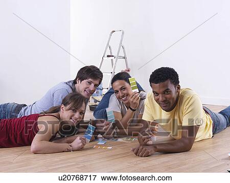 Group of friends choosing paint colours View Large Photo Image Stock Photo - Group of friends choosing paint colours. Fotosearch