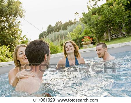 Group of friends in pool View Large Photo Image Stock Photo - Group of friends in pool. Fotosearch
