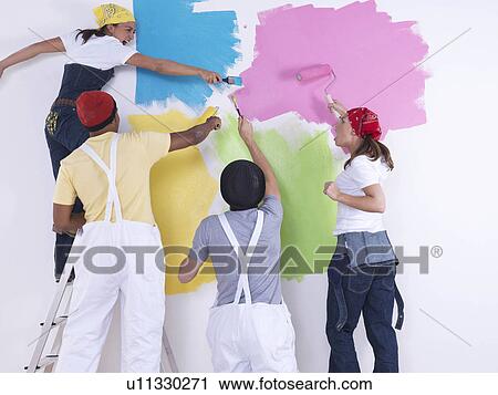 Group of friends painting wall. View Large Photo Image Stock Image - Group of friends painting wall.. Fotosearch