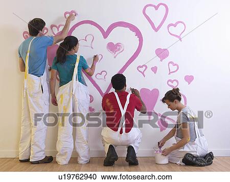 Stock Image - Group painting hearts. Fotosearch