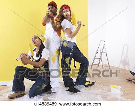 Group posing in front of wall. View Large Photo Image Stock Photo - Group posing in front of wall.. Fotosearch