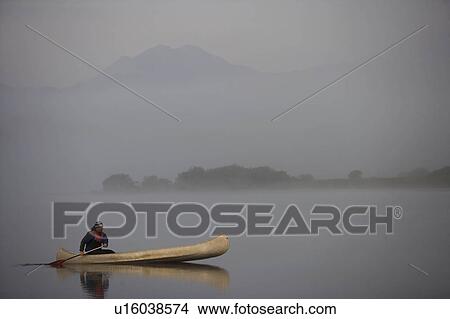 Picture - Kayaking in the morning mist.. Fotosearch