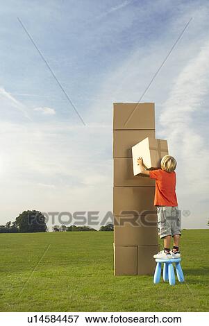 lone boy with box and tower View Large Photo Image Stock Photo - lone boy with box and tower. Fotosearch