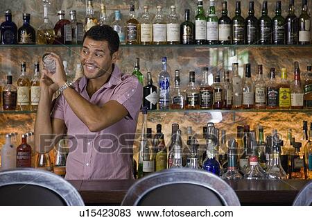 Male bartender mixing drinks View Large Photo Image Stock Image - Male bartender mixing drinks. Fotosearch