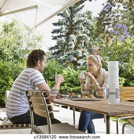 Man and woman eating a meal together View Large Photo Image Stock Image - Man and woman eating a meal together. Fotosearch