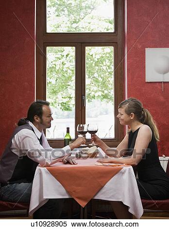 Man and woman having dinner together View Large Photo Image Stock Photography - Man and woman having dinner together. Fotosearch