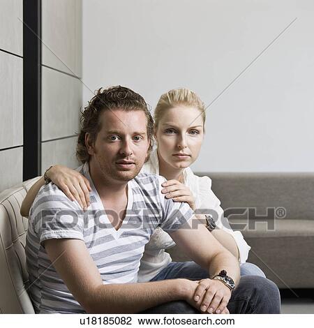 Man and woman in a living room View Large Photo Image Stock Image - Man and woman in a living room. Fotosearch