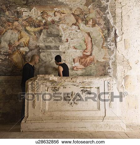 Stock Photograph - Man and woman looking at fresco. Fotosearch