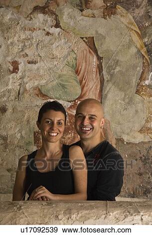 Stock Photo - Man and woman standing at fresco. Fotosearch