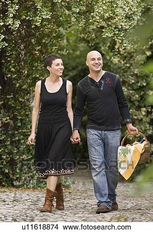 Man and woman with basket View Large Photo Image Picture - Man and woman with basket. Fotosearch