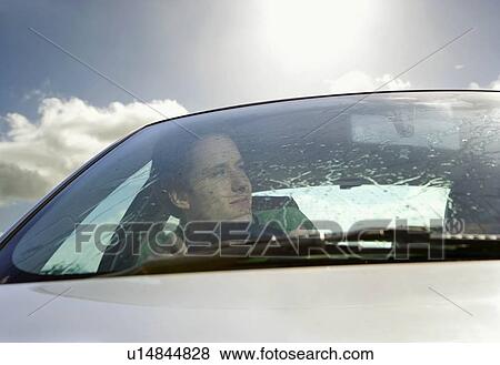 Man driving car View Large Photo Image Stock Photo - Man driving car. Fotosearch