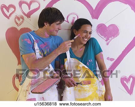 Stock Photo - Man holds pregnant girl.. Fotosearch