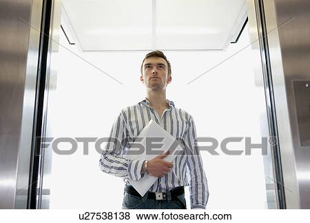 Man in lift View Large Photo Image Stock Photo - Man in lift. Fotosearch