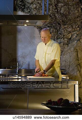 Stock Photo - Man making a meal. Fotosearch