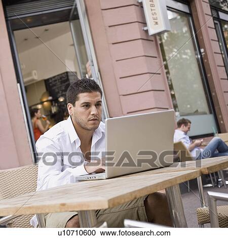 Man outside on laptop View Large Photo Image Stock Image - Man outside on laptop. Fotosearch