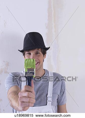 Stock Photography - Man painting.. Fotosearch