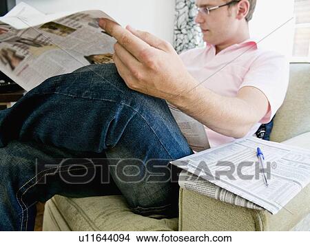 Picture - Man reading newspaper. Fotosearch