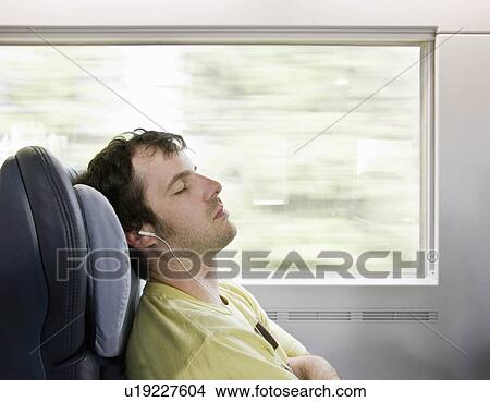 Man sleeping on moving train View Large Photo Image Picture - Man sleeping on moving train. Fotosearch