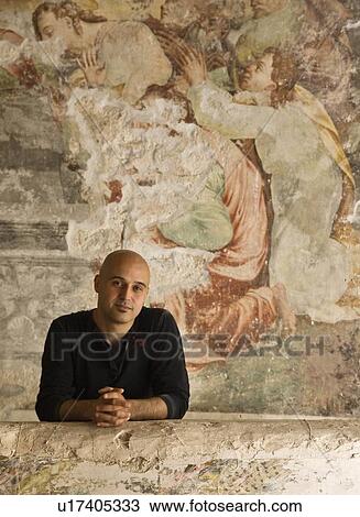 Man standing in front of fresco View Large Photo Image Stock Image - Man standing in front of fresco. Fotosearch