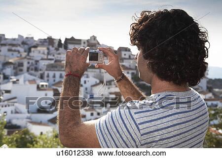 Man taking picture of view View Large Photo Image Stock Photo - Man taking picture of view. Fotosearch