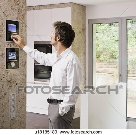 Stock Photo - Man tuning the radio. Fotosearch