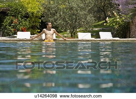 Man wading in the pool View Large Photo Image Stock Photo - Man wading in the pool. Fotosearch