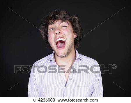 man winking with open mouth View Large Photo Image Stock Image - man winking with open mouth. Fotosearch