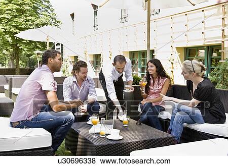 Men and women talking over drinks View Large Photo Image Stock Photo - Men and women talking over drinks. Fotosearch